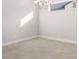Bright dining room with hardwood floors and a chandelier at 12413 Parigi Way, Sarasota, FL 34238