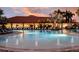 Community boasts a resort-style pool with fountains and plenty of lounge chairs at 12413 Parigi Way, Sarasota, FL 34238