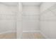 Walk-in closet with wire shelving at 12413 Parigi Way, Sarasota, FL 34238