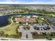 Aerial view of Esplanade's resort-style pool, clubhouse, and parking at 12413 Parigi Way, Sarasota, FL 34238