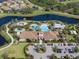 Aerial view of Esplanade's resort-style pool, clubhouse, and parking at 12413 Parigi Way, Sarasota, FL 34238