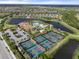 Aerial view of Esplanade's tennis and pickleball courts, near the community pool at 12413 Parigi Way, Sarasota, FL 34238
