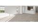 Spacious living area with light walls and tile flooring at 12413 Parigi Way, Sarasota, FL 34238