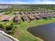 Aerial view of community near lake at 12413 Parigi Way, Sarasota, FL 34238