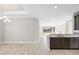 Modern kitchen with open concept floor plan and breakfast bar at 12413 Parigi Way, Sarasota, FL 34238