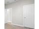 Simple bedroom with light walls and wood-look floors at 12413 Parigi Way, Sarasota, FL 34238