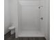 Clean bathroom with a shower and toilet at 13020 Cedar Elm Lane, Parrish, FL 34219