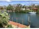 Scenic view of the canal with a sailboat and lush greenery at 1348 Harbor Dr, Sarasota, FL 34239