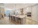 Modern kitchen with white cabinets, large island, and stainless steel appliances at 1403 96Th Nw Ct, Bradenton, FL 34209