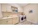 Functional laundry room with washer, dryer and storage at 1403 96Th Nw Ct, Bradenton, FL 34209