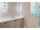 Modern bathroom with a quartz vanity, undermount sink, and glass shower enclosure at 1637 Hyde Park St, Sarasota, FL 34239