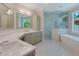 Elegant bathroom with double vanity, large shower, and soaking tub at 1637 Hyde Park St, Sarasota, FL 34239