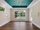 Bedroom with hardwood floors, unique ceiling, and pool view at 1637 Hyde Park St, Sarasota, FL 34239