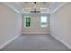 Spacious bedroom with neutral walls and carpet, featuring two large windows and a high ceiling at 1637 Hyde Park St, Sarasota, FL 34239