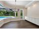 Breakfast nook with built-in cabinetry and pool views at 1637 Hyde Park St, Sarasota, FL 34239