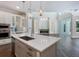 Modern kitchen island with white quartz countertop and stainless steel sink at 1637 Hyde Park St, Sarasota, FL 34239