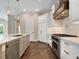 Modern kitchen with stainless steel appliances and hardwood floors at 1637 Hyde Park St, Sarasota, FL 34239