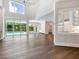 Open living area with hardwood floors, high ceilings, and pool view at 1637 Hyde Park St, Sarasota, FL 34239