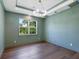 Serene office space with dark hardwood floors and a large window at 1637 Hyde Park St, Sarasota, FL 34239