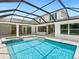 Spacious pool and spa with covered patio and outdoor kitchen at 1637 Hyde Park St, Sarasota, FL 34239