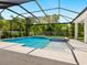 Inviting screened-in pool and spa area, perfect for relaxation and entertainment at 1637 Hyde Park St, Sarasota, FL 34231