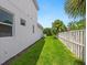 Landscaped side yard with privacy fence at 1637 Hyde Park St, Sarasota, FL 34239