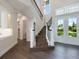 Elegant staircase with dark wood treads and black metal railing at 1637 Hyde Park St, Sarasota, FL 34239