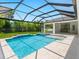 Resort-style pool and spa with a screened enclosure at 1637 Hyde Park St, Sarasota, FL 34239