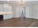 Wet bar with white cabinets, wine cooler, and quartz countertop at 1637 Hyde Park St, Sarasota, FL 34239