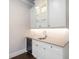 Modern wet bar with glass-front cabinets and sink at 1637 Hyde Park St, Sarasota, FL 34239