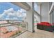 Private balcony with city views and seating area at 1990 Main St # 15, Sarasota, FL 34236