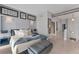 Spacious Primary bedroom with a king-size bed and ensuite bathroom access at 1990 Main St # 15, Sarasota, FL 34236