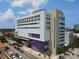 Modern building exterior featuring a unique architectural design with balconies and ample windows at 1990 Main St # 15, Sarasota, FL 34236