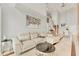 Bright living room with a modern sectional sofa and large artwork at 1990 Main St # 15, Sarasota, FL 34236