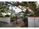 Exterior of a charming house with white columns and lush gardens at 1990 Main St # 15, Sarasota, FL 34236