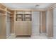 Well-organized walk-in closet with shelves and drawers at 1990 Main St # 15, Sarasota, FL 34236