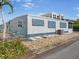 Mobile home with screened porch and side yard at 2107 Palma Sola Blvd # 94, Bradenton, FL 34209