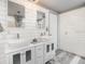 Double vanity bathroom with modern white cabinets and fixtures at 2107 Palma Sola Blvd # 94, Bradenton, FL 34209