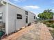 Home exterior featuring a quaint patio, providing an inviting outdoor living space at 2107 Palma Sola Blvd # 94, Bradenton, FL 34209