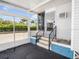 Enclosed front porch with sliding glass windows, offering an inviting outdoor living space at 2107 Palma Sola Blvd # 94, Bradenton, FL 34209