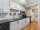 Bright kitchen featuring white cabinets, modern appliances, and a functional layout at 2107 Palma Sola Blvd # 94, Bradenton, FL 34209