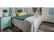 Comfortable bedroom featuring a queen-sized bed, ample storage, and stylish decor at 2107 Palma Sola Blvd # 94, Bradenton, FL 34209