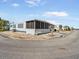 Mobile home with screened porch and landscaped yard at 2107 Palma Sola Blvd # 94, Bradenton, FL 34209