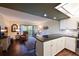 Open living area with hardwood floors and access to a balcony at 315 30Th W Ave # B311, Bradenton, FL 34205