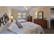 Well-lit bedroom with two beds, ceiling fan, and lots of drawer space at 315 30Th W Ave # B311, Bradenton, FL 34205