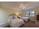 Comfortable bedroom features two beds, ceiling fan, and lots of natural light at 315 30Th W Ave # B311, Bradenton, FL 34205