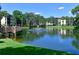 Tranquil pond reflecting the surrounding buildings at 315 30Th W Ave # B311, Bradenton, FL 34205