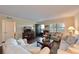 Living room with two sofas, a TV and access to other rooms at 315 30Th W Ave # B311, Bradenton, FL 34205