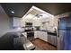 Modern kitchen featuring stainless steel appliances and dark granite countertops at 315 30Th W Ave # B311, Bradenton, FL 34205