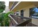 Exterior view of a condo entrance featuring a balcony and outdoor lighting at 315 30Th W Ave # B311, Bradenton, FL 34205